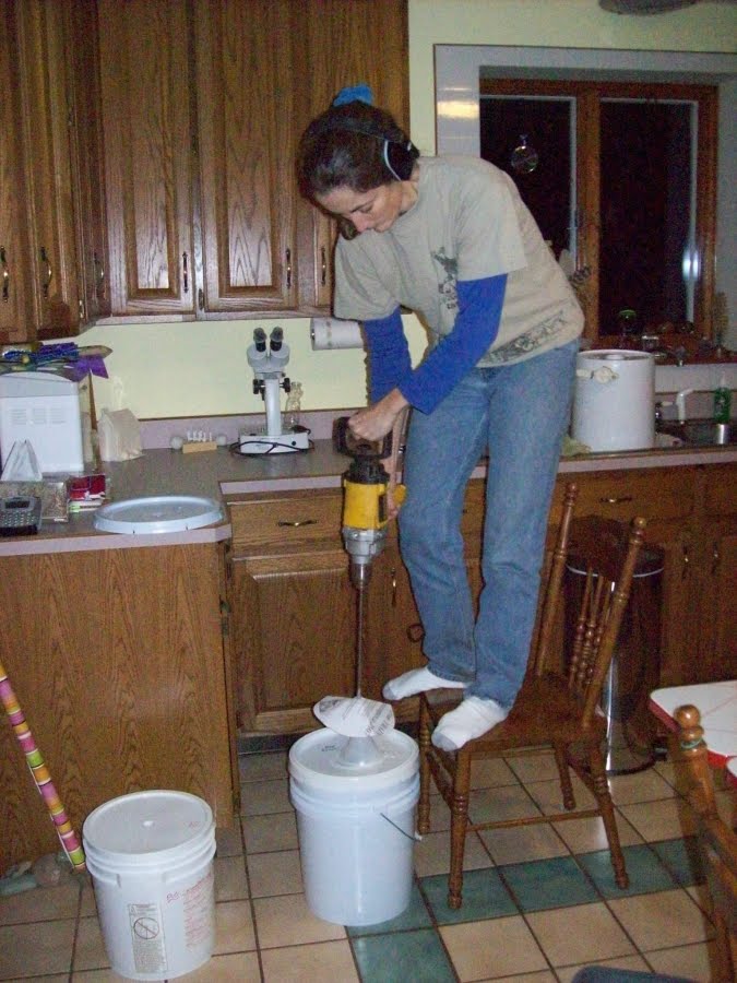 Shows a woman mixing honey