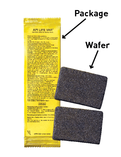 Shows the yellow packaging and brown, sponge-like wafers that make up a package of ApiLife Var