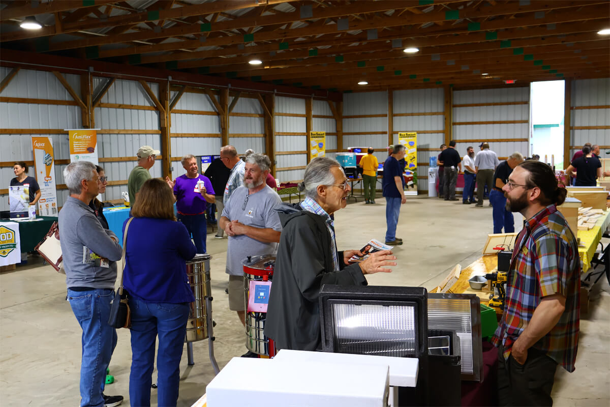 Shows attendees talking to vendors