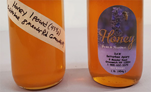 A non-professional honey jar compared to a professionally labeled one.
